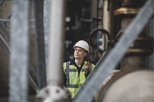 Industrial worker using radio on site