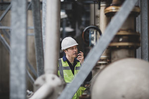 Industrial worker using radio on site