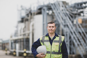 Portrait of mature industrial worker on site