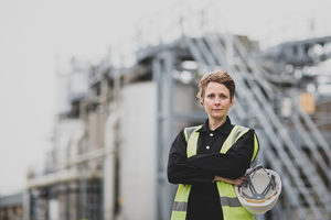 Portrait of female industrial worker on site