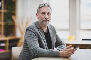 Portrait of businessman at desk