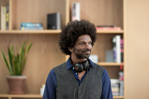 Businessman looking out window thinking