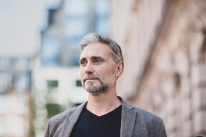 Mature male outdoors in city