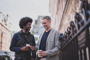 Male friends outdoors in city
