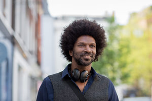 African American walking in city 