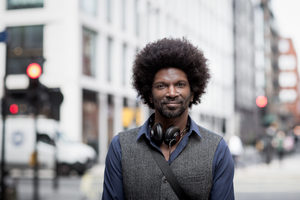 Portrait of African American male outdoors in city