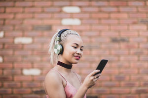 Young adult female streaming music