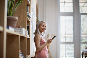 Portrait of young adult student in library