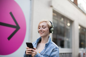 Young adult female streaming music