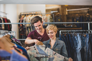 Millennial couple in a vintage clothing store