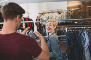 Millennial couple in a vintage clothing store