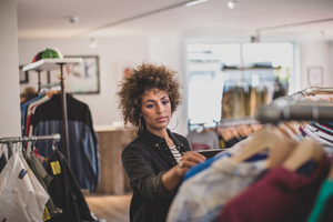Store manager checking stock in a clothing store