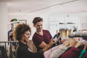 Millennial couple in a vintage clothing store