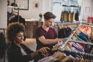 Millennial couple in a vintage clothing store