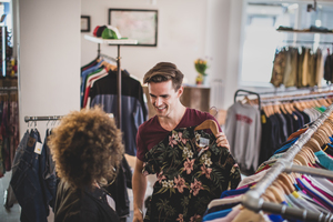 Millennial couple in a vintage clothing store