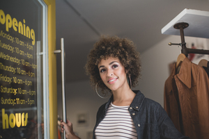Small business owner opening store 
