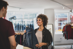 Customer paying for clothes at checkout