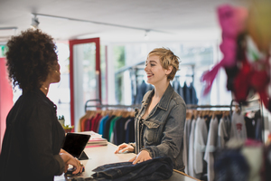 Customer paying for clothes at checkout