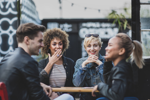 Friends socialising outdoors in summer