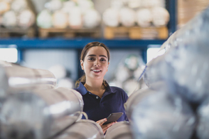 Portrait of female employee in distribution warehouse