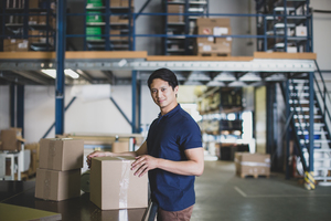 Portrait of male working in packing warehouse
