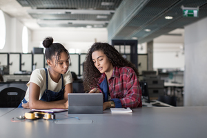 High school students working on robotics in class