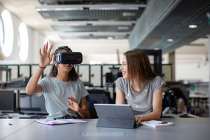 High school students using VR headset in class