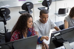 Students learning how to code in class