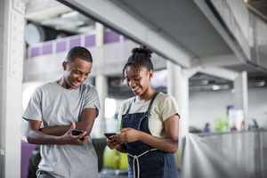 Students looking at smartphones at break time