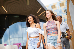 Group of teenagers walking through city