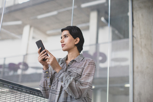 Arabic businesswoman using a smartphone in an office