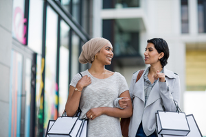 Muslim friends shopping together outdoors