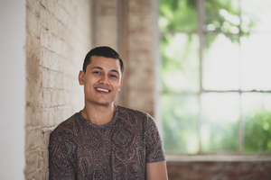 Portrait of millennial male in creative office