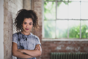 Portrait of millennial female in creative office