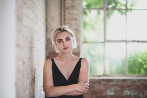 Portrait of millennial female in creative office