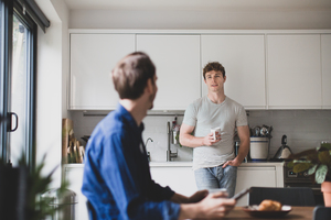 Roommates having breakfast together