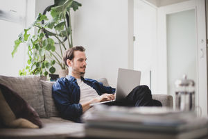 Adult male working from home in living room