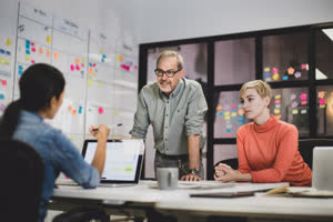 Coworkers working late in an office
