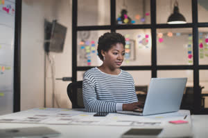 African American female working late in an office
