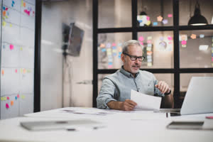 Mature male working late in an office