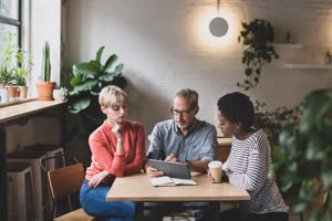 Coworkers having a meeting in a cafe