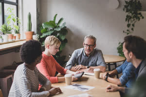 Young adult giving a presentation in a business meeting
