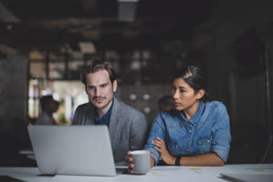 Coworkers working late in the office
