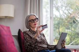 Mature adult female shopping online