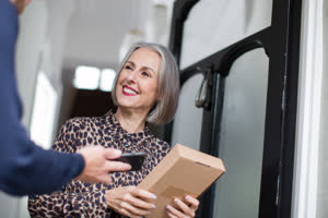 Mature woman receiving a home delivery
