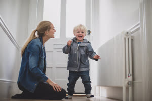 Mother with excited child ready to leave house