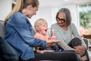 Boy blowing out birthday candles