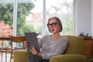 Mature adult female on a videocall to family