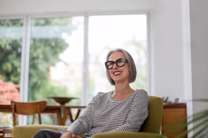 Mature adult female happy at home