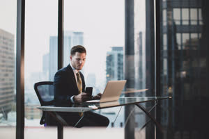 Businessman working in executive office in a skyscraper